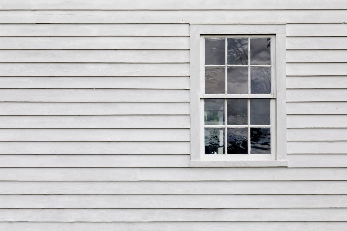 Old Single Pane Window in an Exterior Wall with White Siding, Shoreview